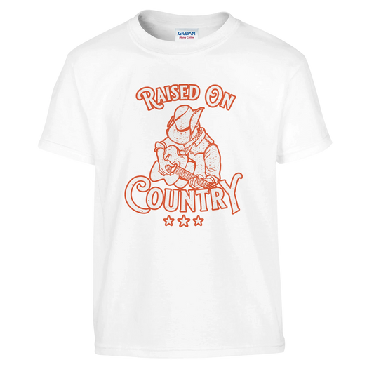 The C2C 2025 Raised On Country Kids T-Shirt by C2C Country To Country features an orange cowboy-with-guitar graphic, Raised On Country text, and three stars. Made from durable, machine washable fabric for easy care.