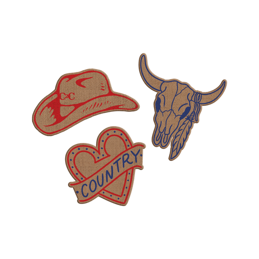 The 2026 Patch Set x3 features three festival-inspired embroidered patches—a cowboy hat, a cow skull with blue horns and feathers, and a heart with a blue "COUNTRY" banner—perfect for customising jackets in country music style.