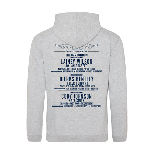 The 2025 Grey Embroidered London Hoodie from C2C Country To Country Store features a blue back print with artists like Lainey Wilson, Dierks Bentley, Cody Johnson & more at The O2, plus two crossed guitars—perfect for concert fans!.