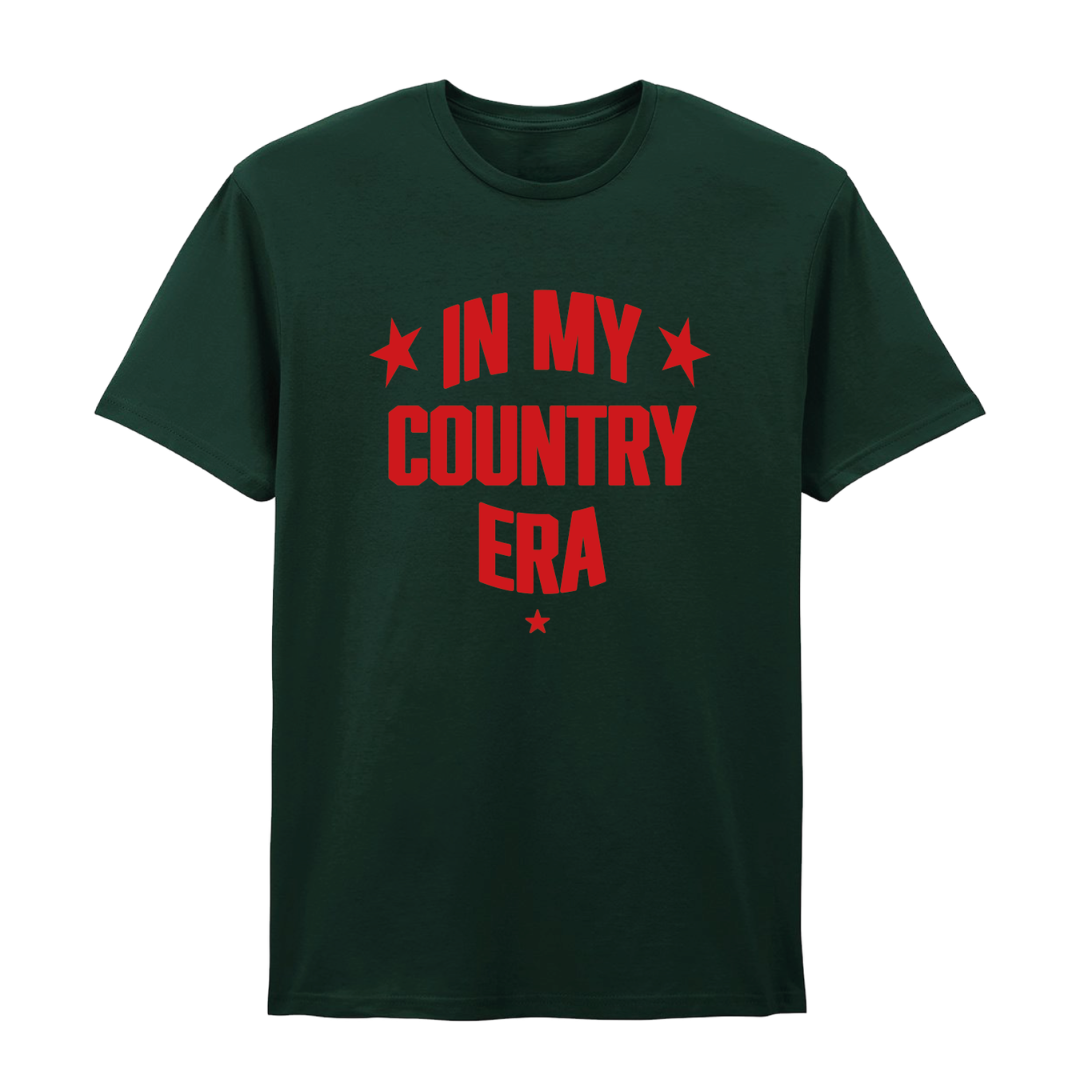 The "In My Country Era T-Shirt" by 2026 is a dark green, era-inspired tee with bold red "IN MY COUNTRY ERA" text and four red stars—ideal for country music and Country to Country Festival fans.