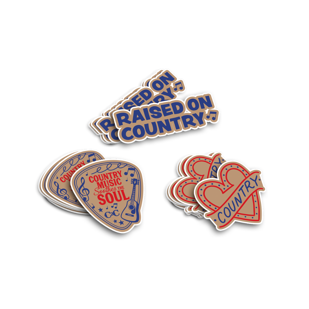 The 2026 Vinyl Sticker Set features vibrant country designs like blue "RAISED ON COUNTRY," a guitar pick saying "Country Music speaks to the soul," and red hearts with "COUNTRY"—a perfect set for any country festival fan.