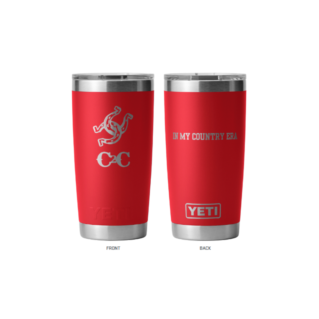 Two red Yeti Tumbler Red cups by 2026, made of durable stainless steel. Triskelion with two interlocked horseshoes on front; "IN MY COUNTRY ERA" above the YETI logo on back. An insulated festival-ready cup for any occasion.
