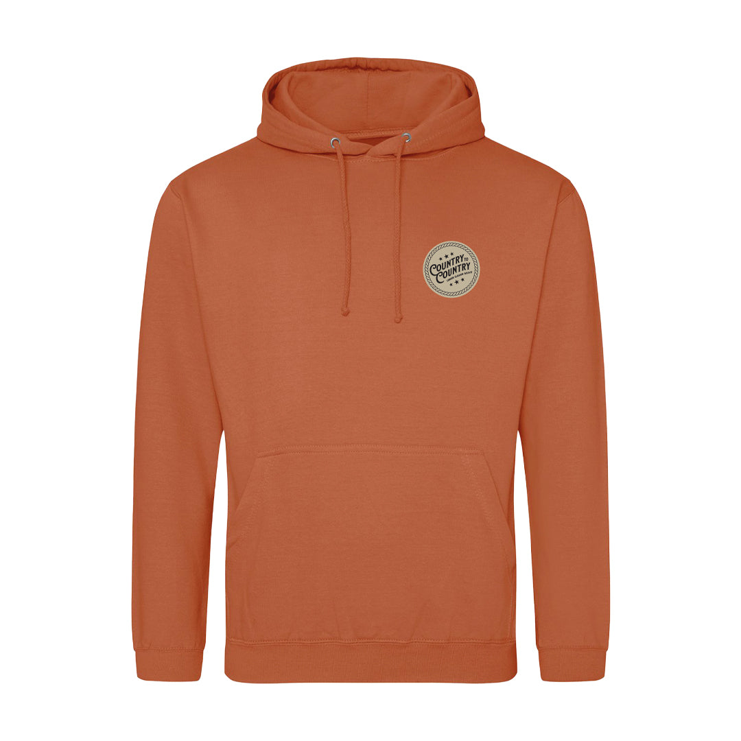 The 2025 Ginger Biscuit London Hoodie from C2C Country To Country Store features a rust color, front pocket, drawstring hood, and a left-chest patch reading “Caffeine & Comfort”—ideal for cozy, laid-back style and daily comfort.